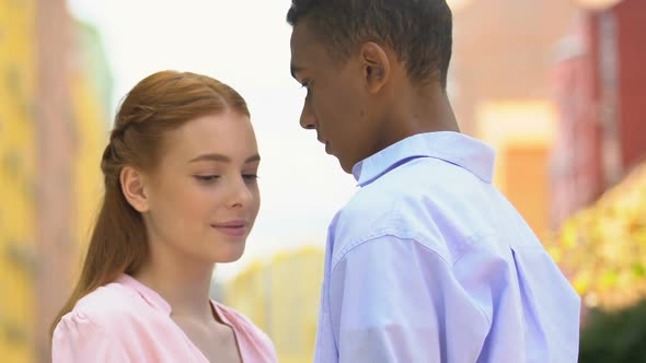 Beautiful Multiracial Teenage Couple Tenderly Embracing at Outdoor Date, Love