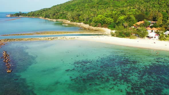 Aerial view abstract of relaxing bay beach voyage by blue ocean with bright sandy background of a da