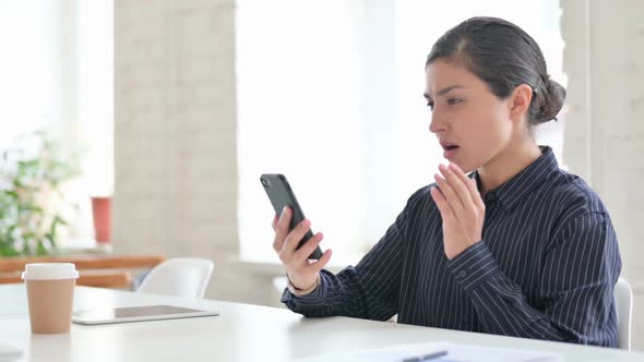 Young Indian Woman Having Loss on Smartphone