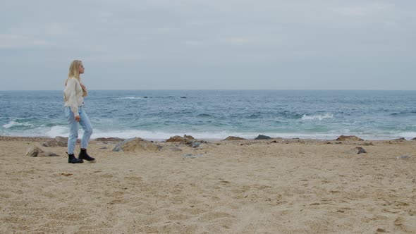 Woman Is Walking On Ocean Coast