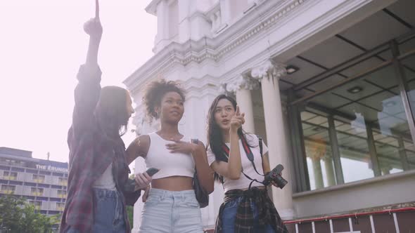 A group of multi-ethnic female friends enjoying the city tour.