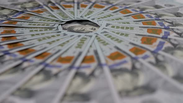 A Lot of Hundreddollar Bills are Lying Around and Slowly Rotating