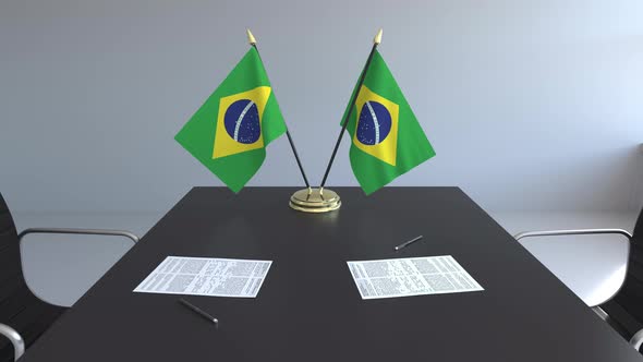 Flags of Brazil and Papers on the Table alt