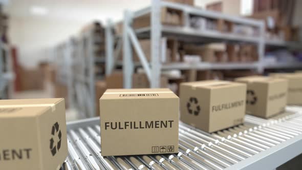 Cardboard Boxes with FULFILLMENT Text on Conveyor