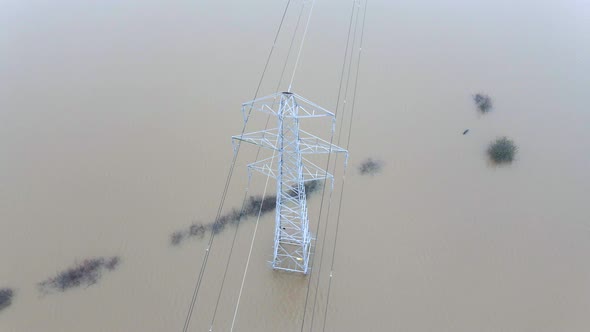 An Electricity Pylon in Deep Water in a Floodwaters Causing Power Cuts 