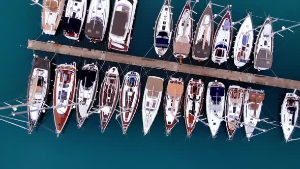 Aerial top view of boats and yachts in marina from above.