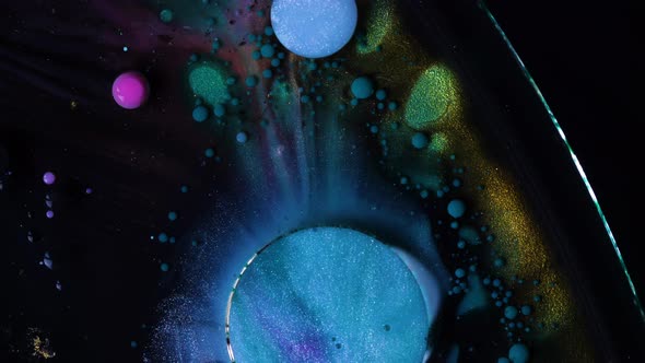 Abstract Acrylic Paint Spread Blast Explode Galaxy. Bright colored bubbles sparkling.