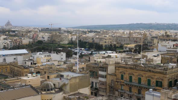 An overhead shot of a town and Our Lady of Mount Carmel Valletta Malta