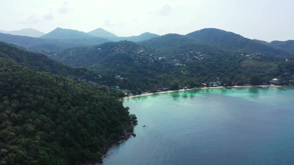 Aerial top down sky of paradise lagoon beach trip by blue water with bright sandy background of a da