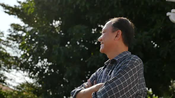 Close Up Of Happy Asian Old Man With Nature Background