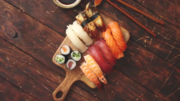 Sushi Set. Different Kinds of Sushi Rolls on Wooden Serving Board