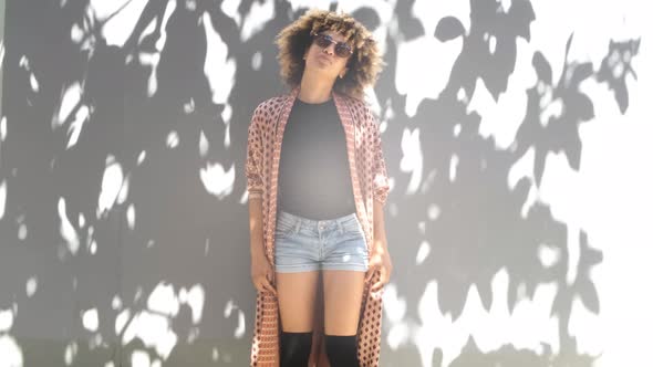 Charming Black Woman Posing in Sunlight 