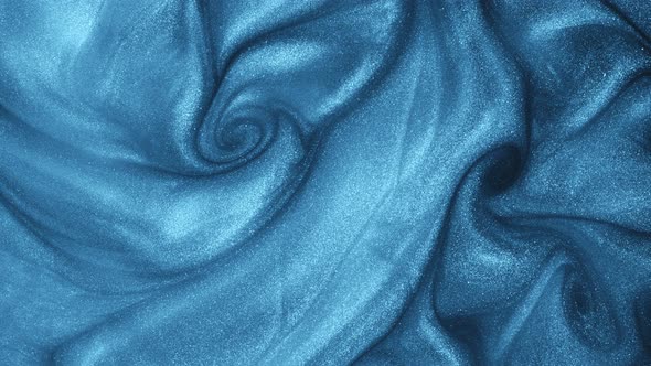 Super Slow Motion Shot of Blue Glittering Fluid Background at 1000Fps alt