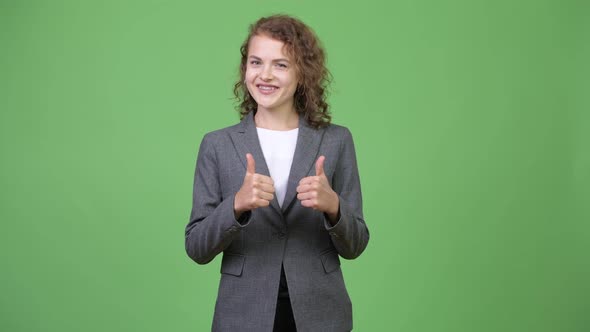 Young Happy Beautiful Businesswoman Giving Thumbs Up