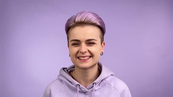 Smiling Stylish Gen z Young Adult Woman Smiling on Camera Indoors