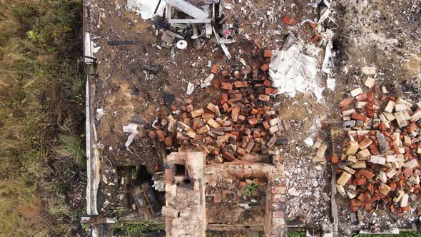 Remains of a Burnt House with a Chimney Protruding From the Ruins Aerial View