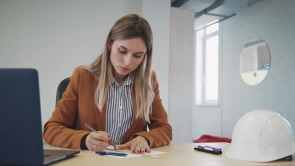 Woman Starting New Architecture Project Sitting in Office