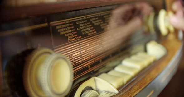 Closeup of a Hand Turning on a Vintage Soviet Radiola