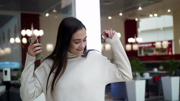 Dancing to Music From your Phone in the Mall