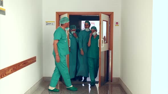 Surgery team leaving the operating room