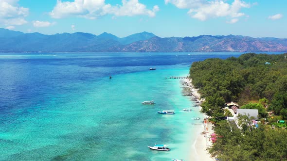 Tropical drone copy space shot of a white paradise beach and blue water background in colorful 4K