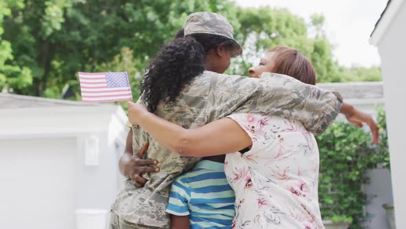 Video of african american family welcoming soldier mother after returning home
