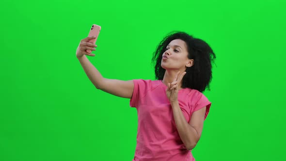 Portrait of Young Female African American Making Selfie on Mobile Phone