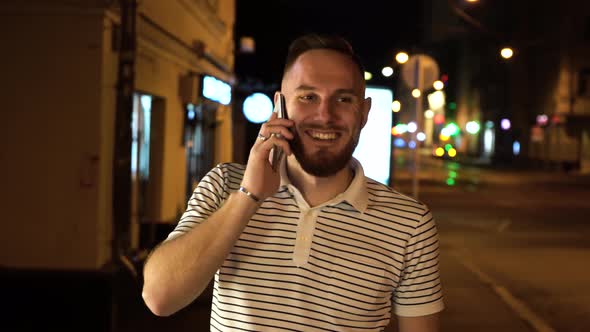 Nice Bearded Man Have a Mobile Phone Call. He Answers It and Start To Chatting with Somebody. Stay