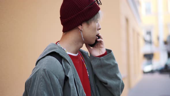 Korean guy talking with his friend on the phone