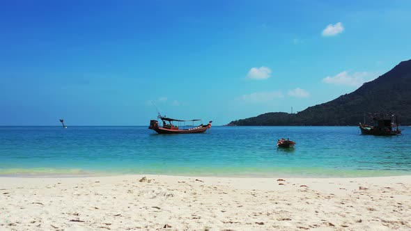 A Beautiful Tropical sandy beach  with crystal clear turquoise water.