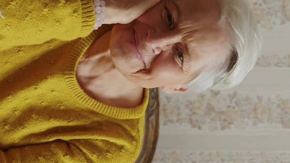 Cute Caucasian Senior Woman Smiling at the Camera Medium Closeup Vertical Video Senior People