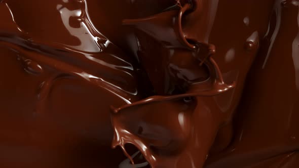 Super Slow Motion Shot of Splashing Melted Chocolate Background at 1000Fps.