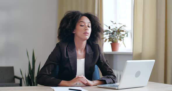 Tired Exhausted Afro Woman Bored of Routine Work Study in Office at Home with Laptop, Loses Energy