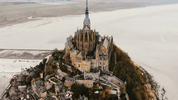 Drone Flying High Around Famous Mont Saint Michel, Ancient Tidal Island Town Fortress and Travel