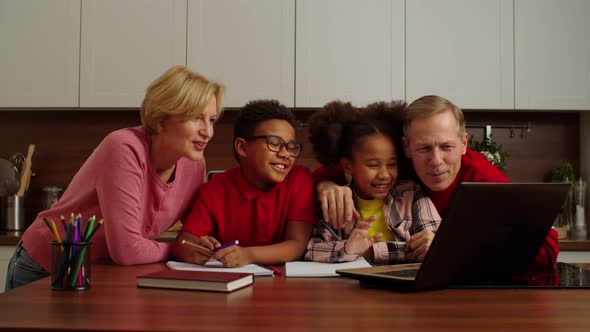 Smiling Grandparents and Preadolescent Multiethnic Kids Making Video Call Online