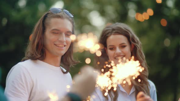 Young People At Celebration Party With Sparklers