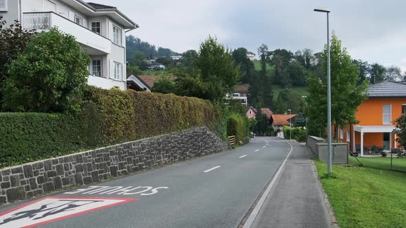 Empty Street in Alps Mountain Eschen City Liechtenstein Houses on the Sides