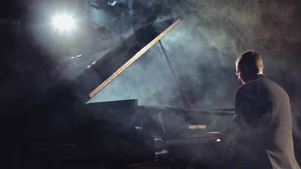 Pianist Playing on a Grand Piano