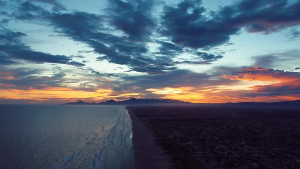 Vibrant sunset at Itanhaem Sao Paulo Brazil. Colorful tropical beach scenery.