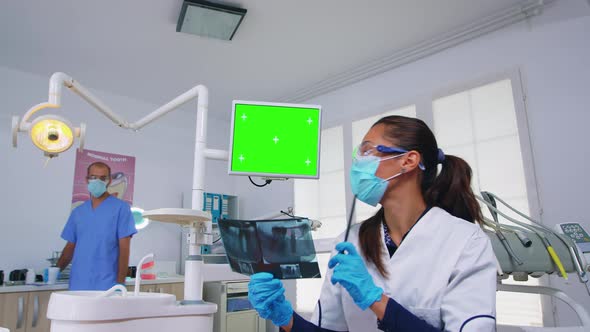 Dentist Doctor Showing Unit Monitor with Mockup Screen Pov Patient