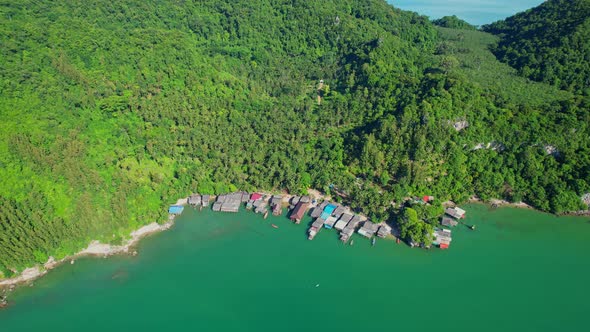 Aerial shot of local fisherman village beside the sea