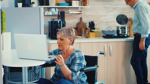 Old Woman Working on Laptop