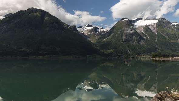 Reflection Of The Lovatnet Lake In Loen, Norway During Daytime - wide shot