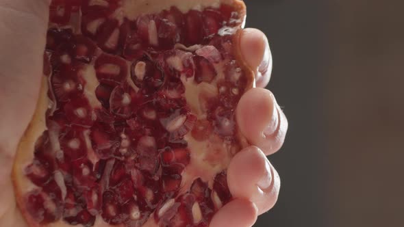 Squeezing Juicy Pomegranate