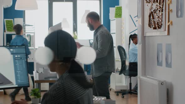 Architect Analyzing Building Model and Maquette in Architectural Office