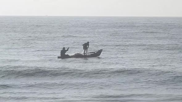 People fishing in ocean in morning, traditional boat fishing in sea. Sea fishing boat in morning.