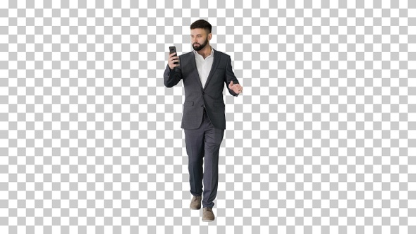 Businessman walking and making a video call, Alpha Channel
