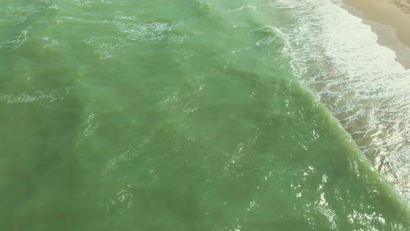 Aerial View. View From Flying Drone on Green Water with Waves in Azov Sea