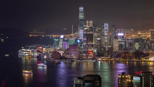 Hong Kong Urban Cityscape Aerial Skyline Panorama Timelapse at Night Pan Up