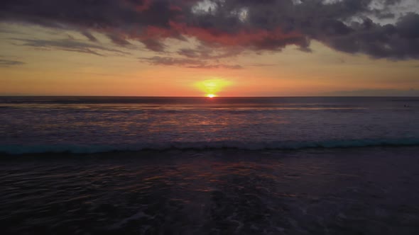 Flight at Sunset Overlooking the Indian Ocean in Bali Indonesia